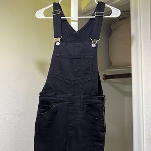 Black Levi overalls, skinny leg